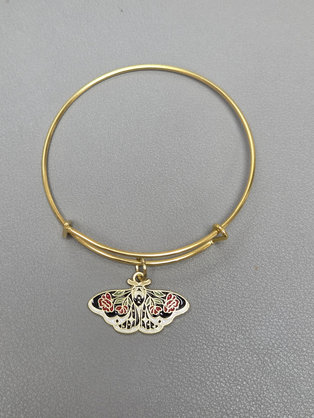 Gold-Tone Moth Charm Bangle Bracelet with Black and Red Enamel Accents